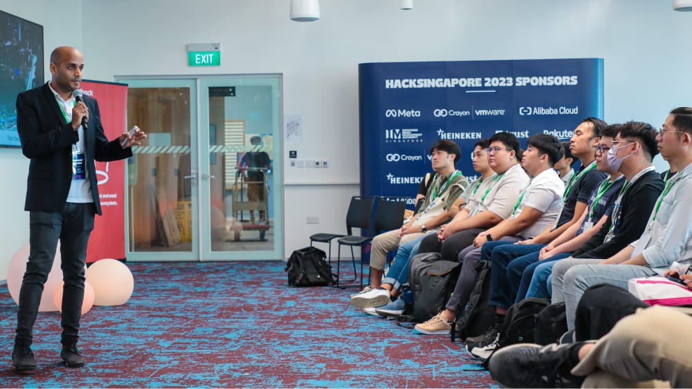 A person delivering a speech to an attentive audience at a public event.